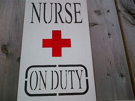 A Sign That Says Nurse And Red Cross On Duty