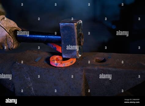 Blacksmith Manually Forging Molten Metal Hi Res Stock Photography And