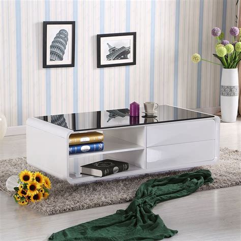 A coffee table is always a useful feature in the living room and sometimes they install them with shelves underneath, but what if you need this black coggee table with thin drawers is based on industrial wheels and contrasted with a natural wooden square top. DESIGN HIGH GLOSS WHITE COFFEE TABLE WITH 2 DRAWERS, SHELVES & BLACK GLASS TOP (With images ...