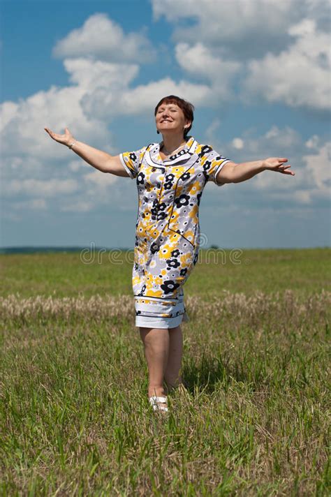 Happy Mature Woman Standing In The Field Stock Photo Image Of Closed