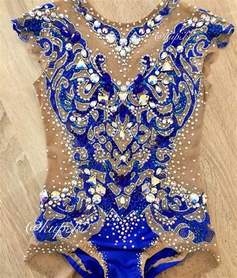 A Womans Leotard With Blue And Silver Sequins On It