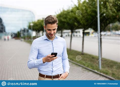 Handsome Businessman Using Smartphone And Smiling Happy Young Man