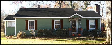 So it looks like mindful gray is my choice. Here's one idea. Green house with deep, dark red shutters ...