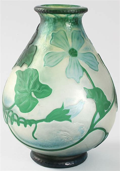 A French Art Nouveau Clear Glass Vase With Green Cameo Overlay In A Squash Blossom Motif By Daum