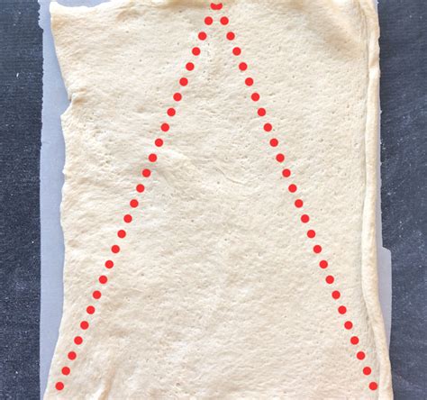 Pinch the middle seam to seal and stretch the dough to form a single triangle. Christmas tree spinach dip breadsticks - It's Always Autumn