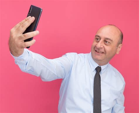 Free Photo Smiling Middle Aged Man Wearing White T Shirt With Tie Take A Selfie Isolated On