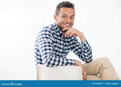 Portrait Of Handsome Smiling Man Sitting On Chair Stock Image Image