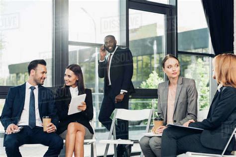 Multicultural Businesspeople Having Meeting In Conference Hall Stock