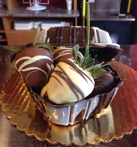 You can do chocolate covered strawberries in a number of different ways, but if you use your imagination, you can come up with something that guests will be talking about for a long time to come. Small chocolate box filled with chocolate-covered ...