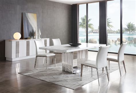 Now existing in a myriad of different colours and wood finishes, the chair has evolved to suit the modern home. Modrest Kingsley Modern Marble & Stainless Steel Dining Table