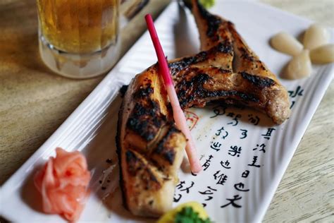 The summer grilling season is heating up, and if you're thinking about a cookout for the upcoming july 4th holiday, you might be shopping around for a new grill. Grilled yellowtail collar Hamachi Kama with a fresh beer ...