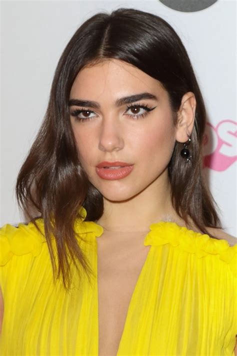 You won't get through these pics without contemplating a major hair change. Dua Lipa Straight Dark Brown Hairstyle | Steal Her Style