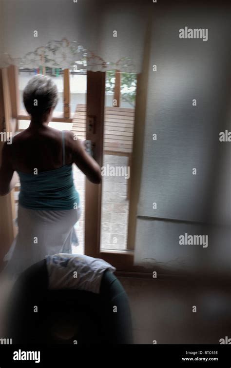 Nosey Woman Window High Resolution Stock Photography And Images Alamy