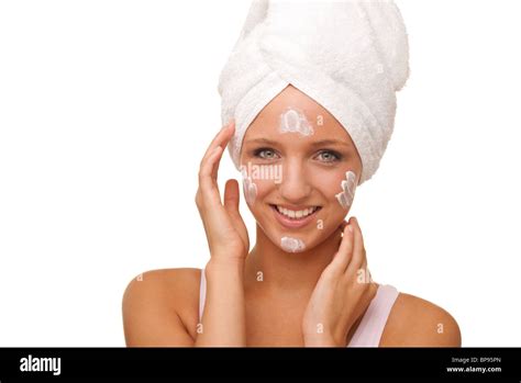 Woman Applying Face Cream Stock Photo Alamy
