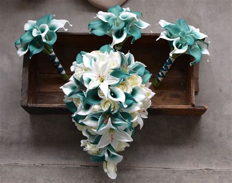 A Bouquet Of White And Blue Flowers In A Wooden Box