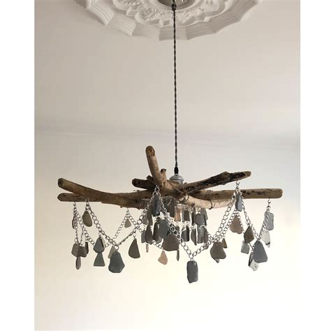 The latest data suggest progress for women at work has stalled. Driftwood and sea glass chandelier handcrafted with ...