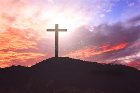 Concept Of Jesus Christ White Cross On Sunset Sky Background Stock