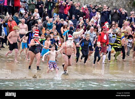 Swimmers And Spectators At The New Years Day Dip In Newquay Harbour
