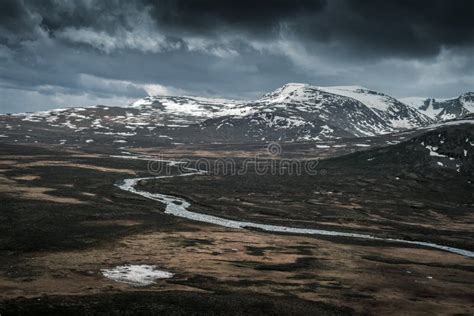 River Leirungsae With Snow Covered Mountains In Jotunheimen National