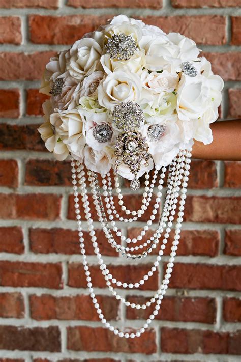 Ways to save on your wedding flowers. DIY Elegant Brooch and Pearl Cascading Bridal Bouquet