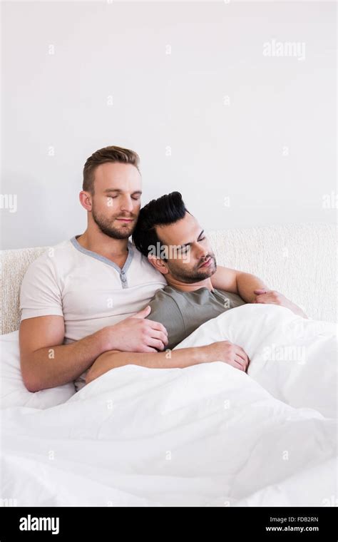 Asleep Gay Couple Lying In Bed Stock Photo Alamy