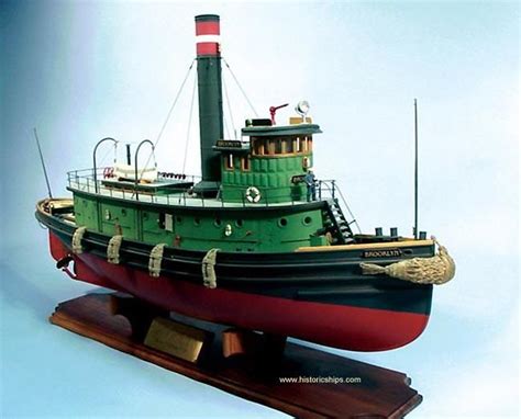 Model Of A Tugboat Showing Rope Fenders Along The Side And Bow Pudding