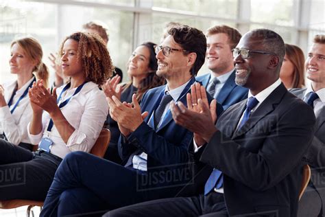 Smiling Audience Applauding At A Business Seminar Stock Photo Dissolve