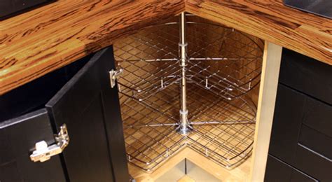 It features a storage cabinet with glass doors and additional shelves that increase its storage capacity. Kitchen Corner Storage Cabinets - Solid Wood Kitchen Cabinets