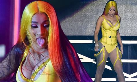 Cardi B Puts On A VERY Raunchy Show In A Glittering Bodysuit With Racy Suspenders At Gig
