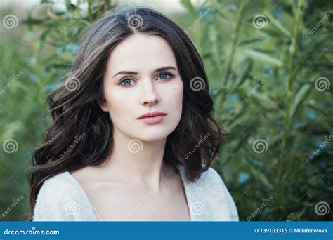 Young Woman Outdoors On Green Spring Leaves Background Beauty Girl