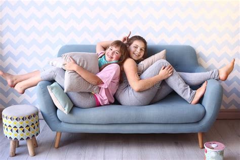 Teenager Blond Sister In Pajamas On The Sofa Stock Image Image Of