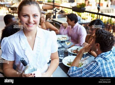 Waitress Serving Tables At Outdoor Restaurant Stock Photo Alamy