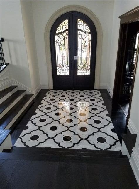 A Classy Foyer Featuring An Glamorous Flooring With Black Paint And