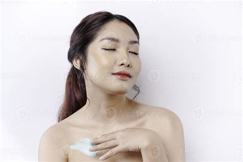 Skin Care Products Concept Asian Woman Applying Moisturizing Lotion On Body After Shower