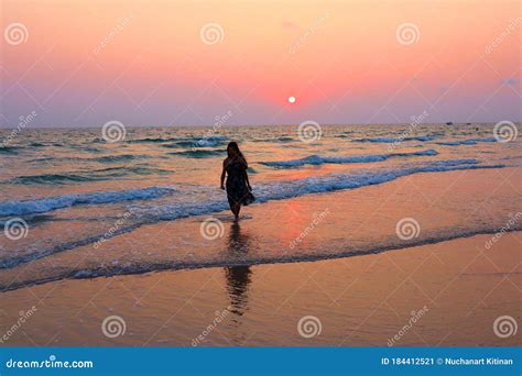 A Girl Running On A Beautiful Beach At Sunset Stock Image Image Of