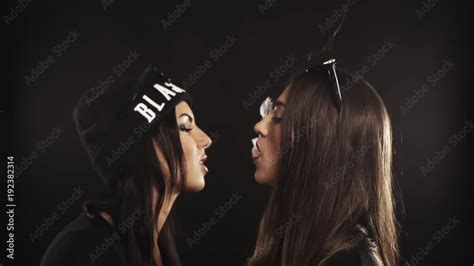 Vidéo Stock Two Sexy Lesbian Caucasian Brunette Girls With Sunglasses On Forehead Leans To Each