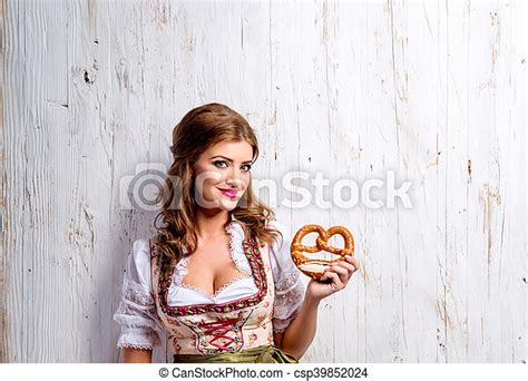 Woman In Traditional Bavarian Dress Holding Pretzel Wooden Back