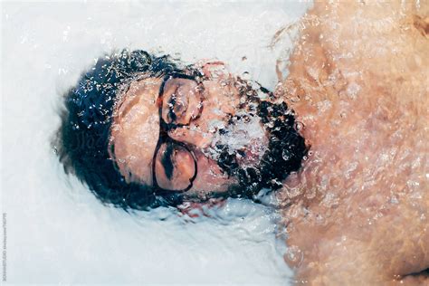 Man Holding Breath Underwater In The Bathtub By Stocksy Contributor