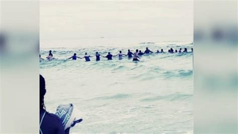 Dozens Of Strangers Form Human Chain To Rescue Swimmers At Florida