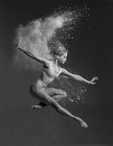 A Black And White Photo Of A Woman Diving