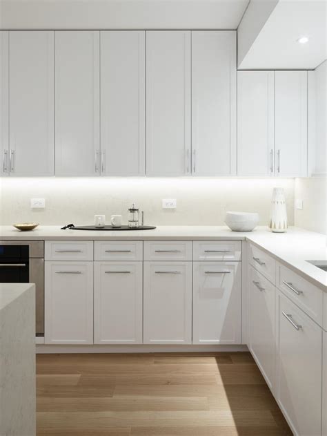 Affordable cabinets for kitchens and bathrooms from homecrest help create personal, organized designs for your home. Clean White Kitchen Cabinets With Metallic Pulls | HGTV