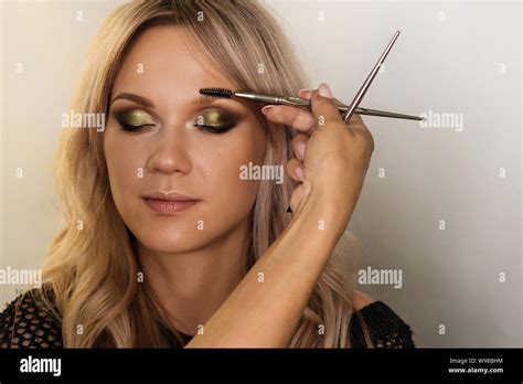 Work Makeup Artist Makeup Artist Combing Eyebrows Of Model With