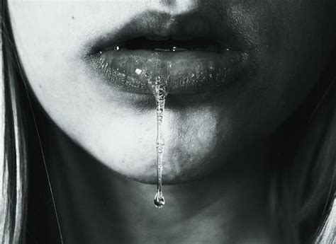 A Womans Face With Water Dripping From Her Mouth