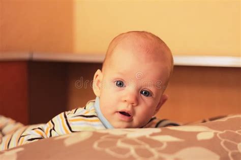 Portrait Of Baby Awake Looking At The Camera Stock Photo Image Of