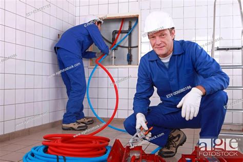 Two Plumbers Working Stock Photo Picture And Low Budget Royalty Free