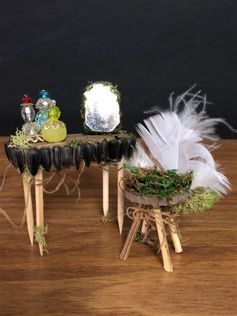 Dressing table edged with sunflower seeds & feather chair. | Fairy