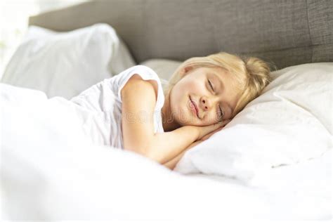 A Little Girl In Bed Sleeping And Dreaming Stock Image Image Of