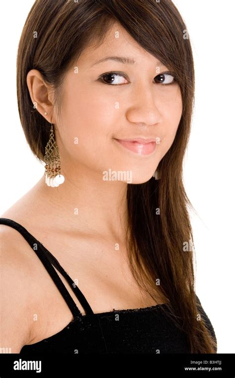 A Cute Young Woman With A Cheeky Smile In Black On White Stock Photo