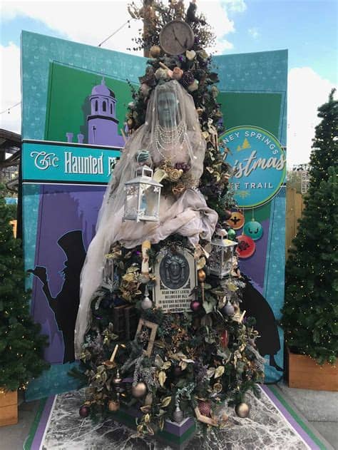 A tree with branches this big isn't my christmas tree is artificial, green and its decorations are red and gold. Guide to Walt Disney World Resort Christmas Events