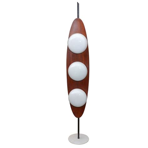 Laminating the fiberglass to the foam is step one. 1960's "Surfboard" Floor Lamp Edited by Reggiani at 1stdibs